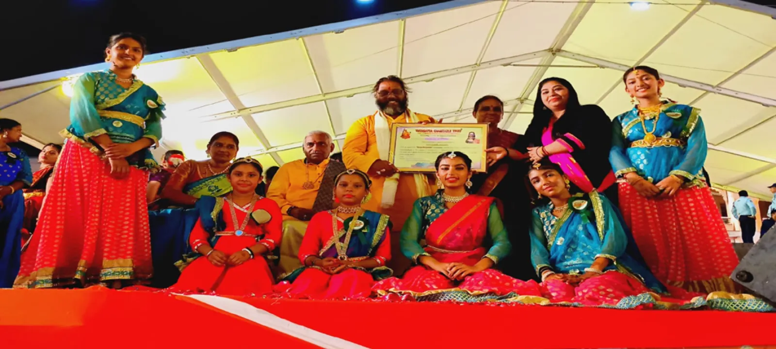 Students receiving a certificate at a Bhartiya Sanskriti Foundation cultural event
